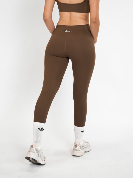 Brown HŌNEY Pilates Leggings.