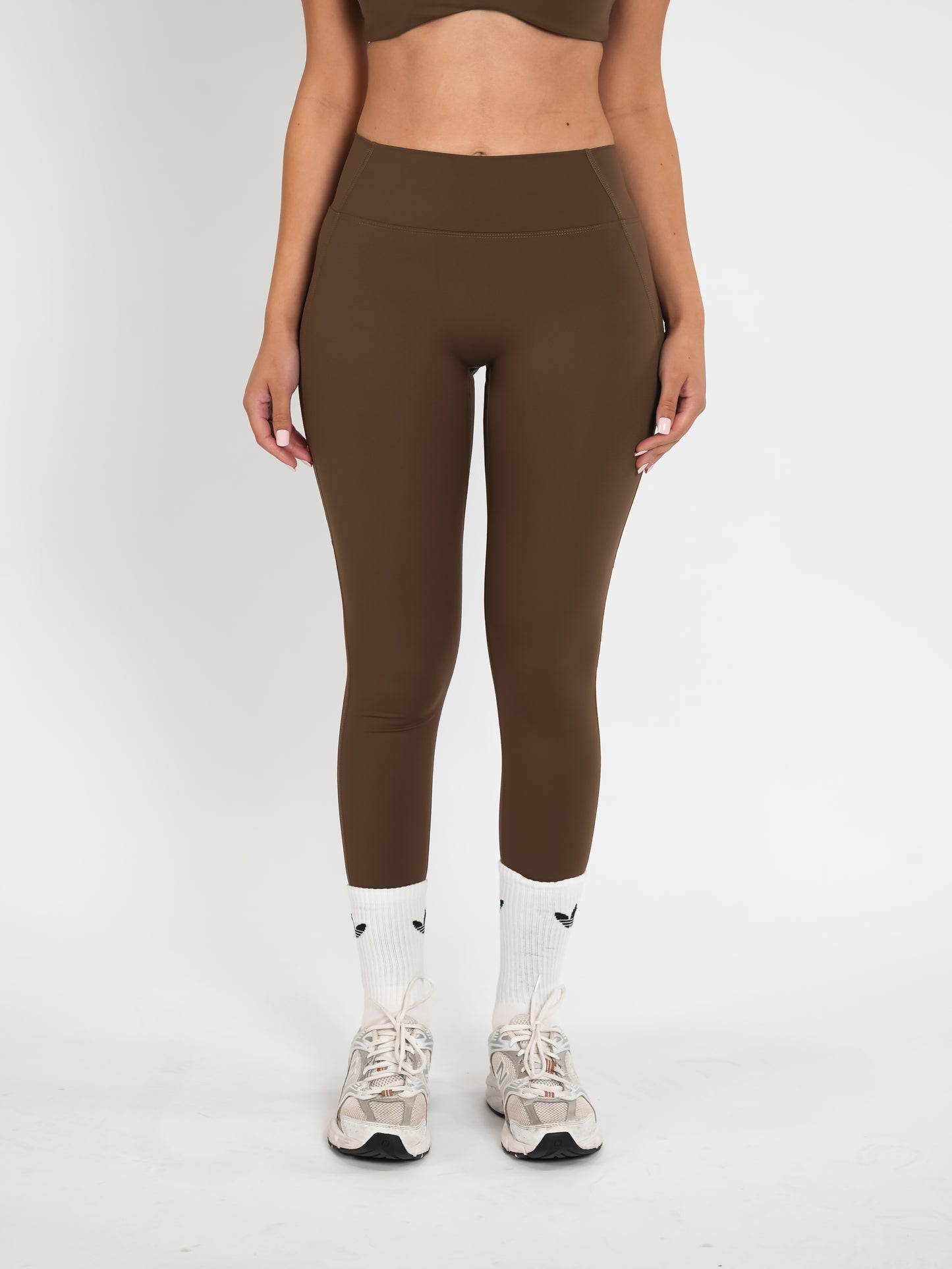 Brown HŌNEY Pilates Leggings.